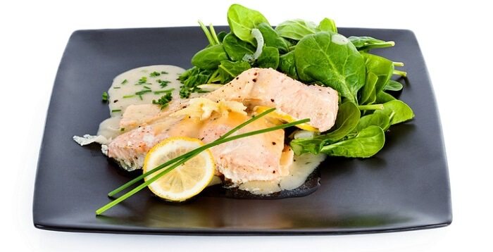 salmon dish with spinach and lemon