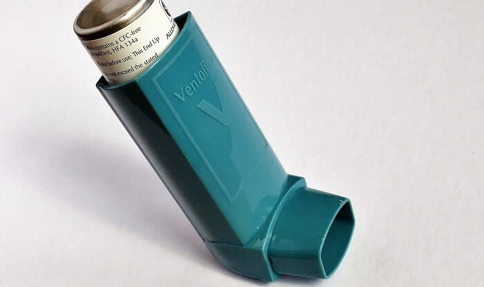 asthma inhaler on white background