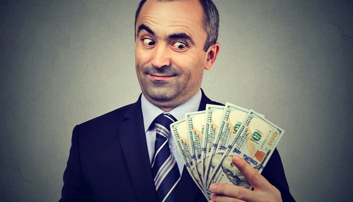 sly businessman with cash - money can't buy happiness concept