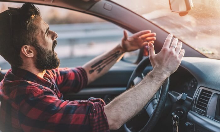 stressed-out man driving in traffic