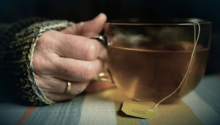 turmeric tea in clear tea cup